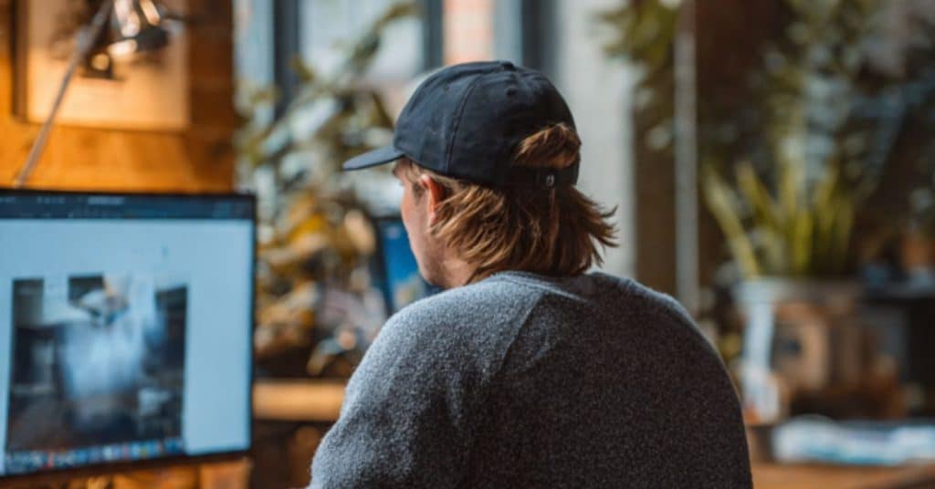 Entrepreneur selecting between Shopify and WooCommerce to build a brand.com site