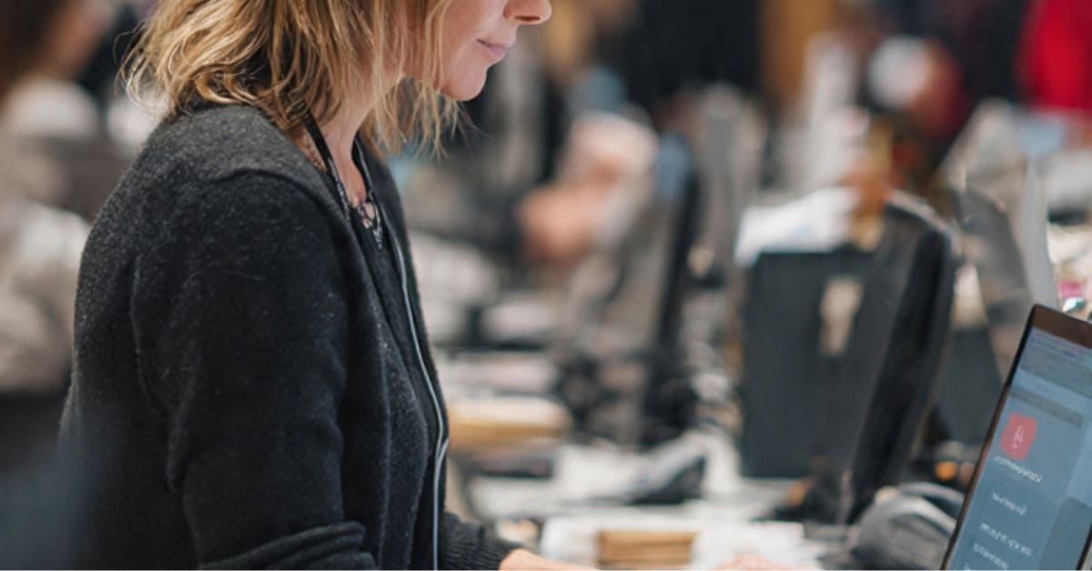 A worker scanning products to track OOS expiry and replenishment cycles