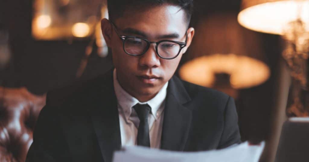 Entrepreneur reviewing SSM documents to register a company in Malaysia