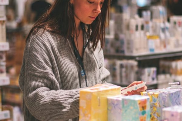 Merchandiser setting up in-store promotions and POSM materials