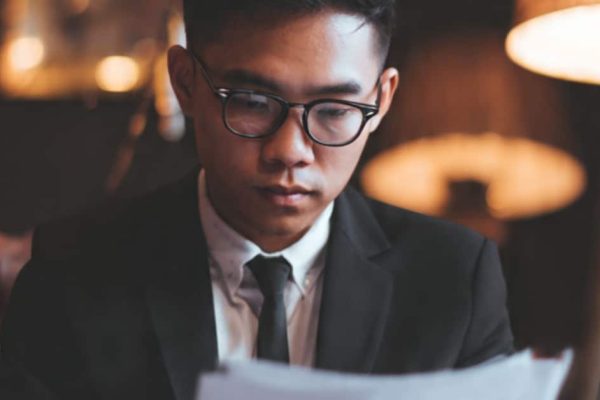 Entrepreneur reviewing SSM documents to register a company in Malaysia